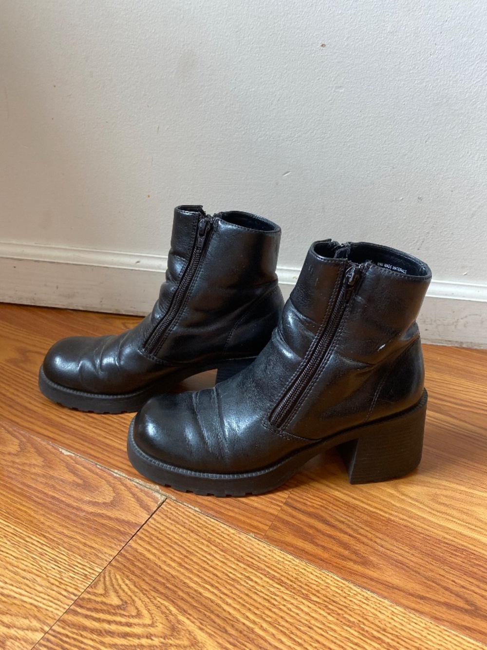 platform boots with a chunky block heel and a double zipper closure